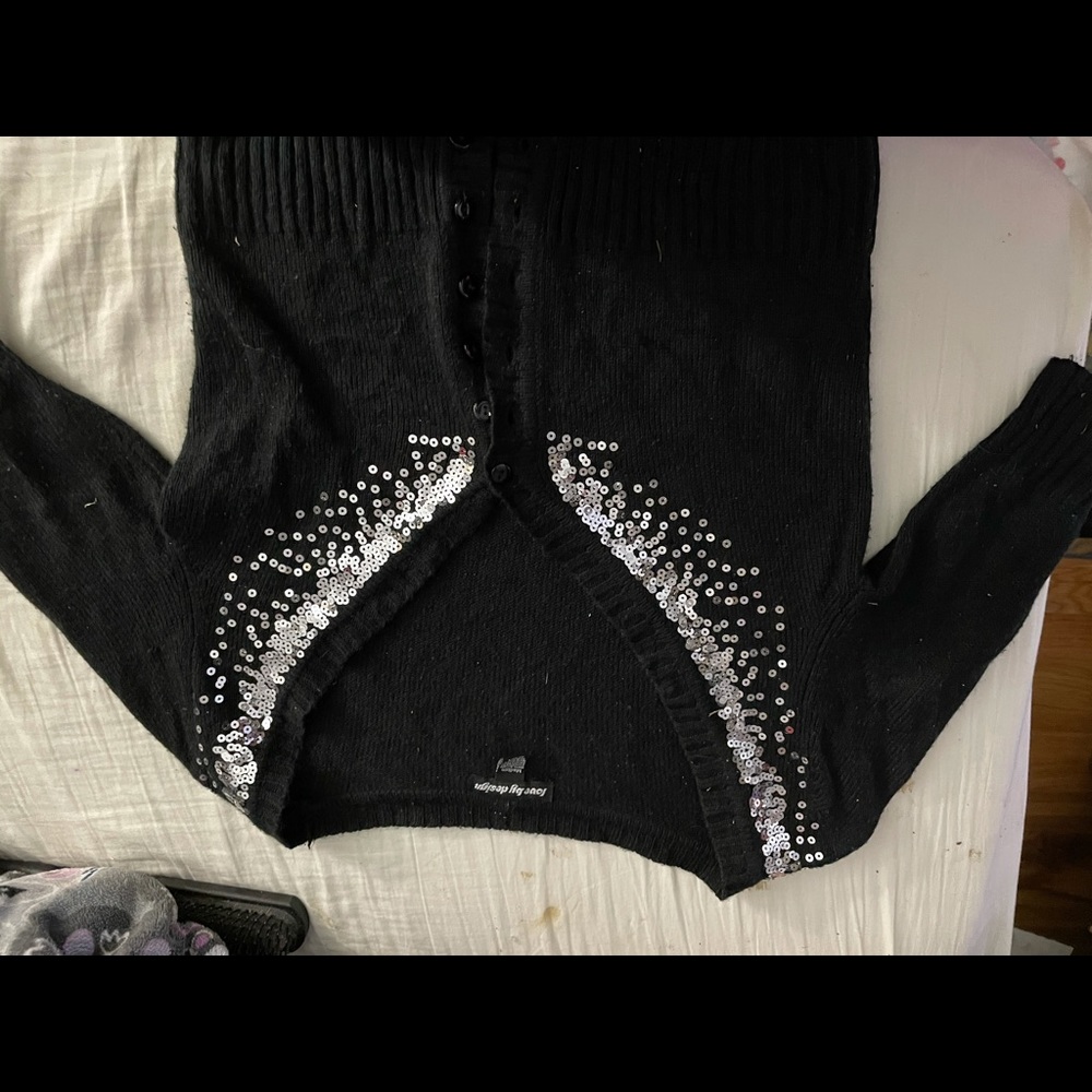 black knit sweater with sliver decorations